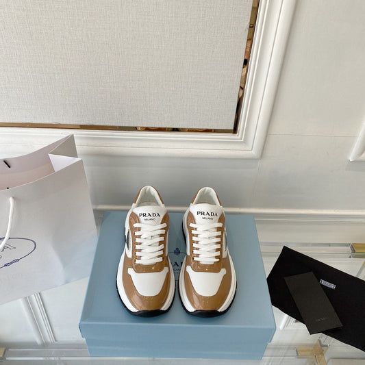 PRADA 25S THICK SOLE SNEAKER IN WHITE AND BROWN CALFSKIN - 34