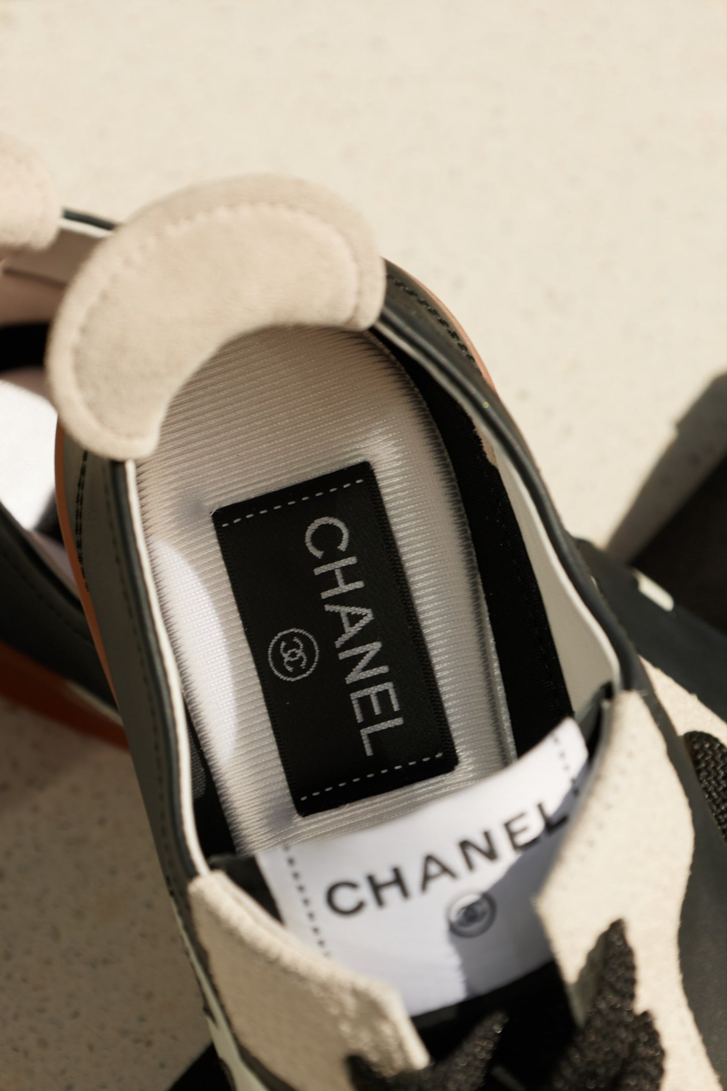 Chanel Black & White Leather Low-Top Sneakers with Oversized CC Logo & Gum Sole
