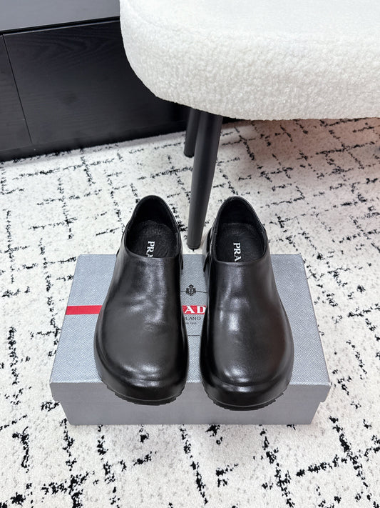 PRADA 26S SLIP ON SHOES IN BLACK SMOOTH CALFSKIN