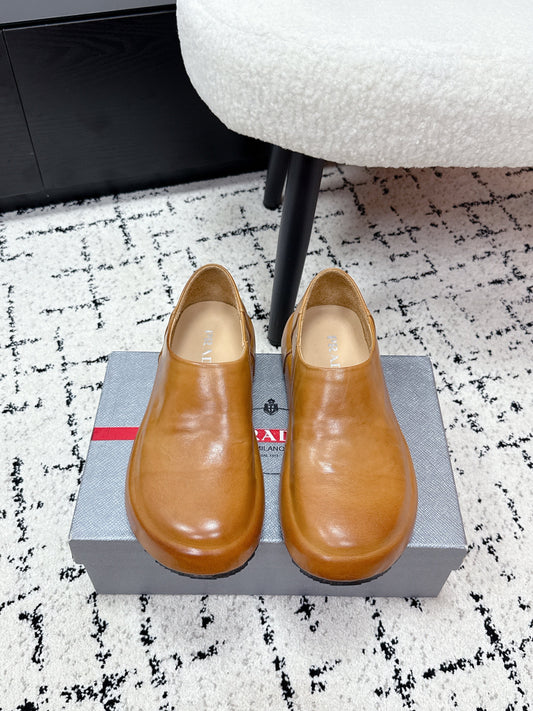PRADA 26S SLIP ON SHOES IN WARM BROWN SMOOTH CALFSKIN