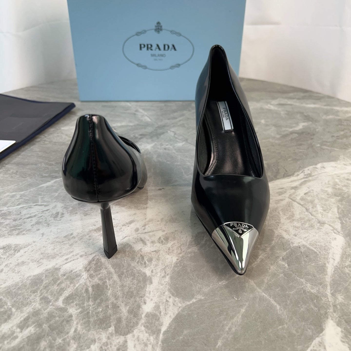 PRADA 25S METAL-CAPPED POINTED-TOE HIGH HEELS IN BLACK CALFSKIN - 34