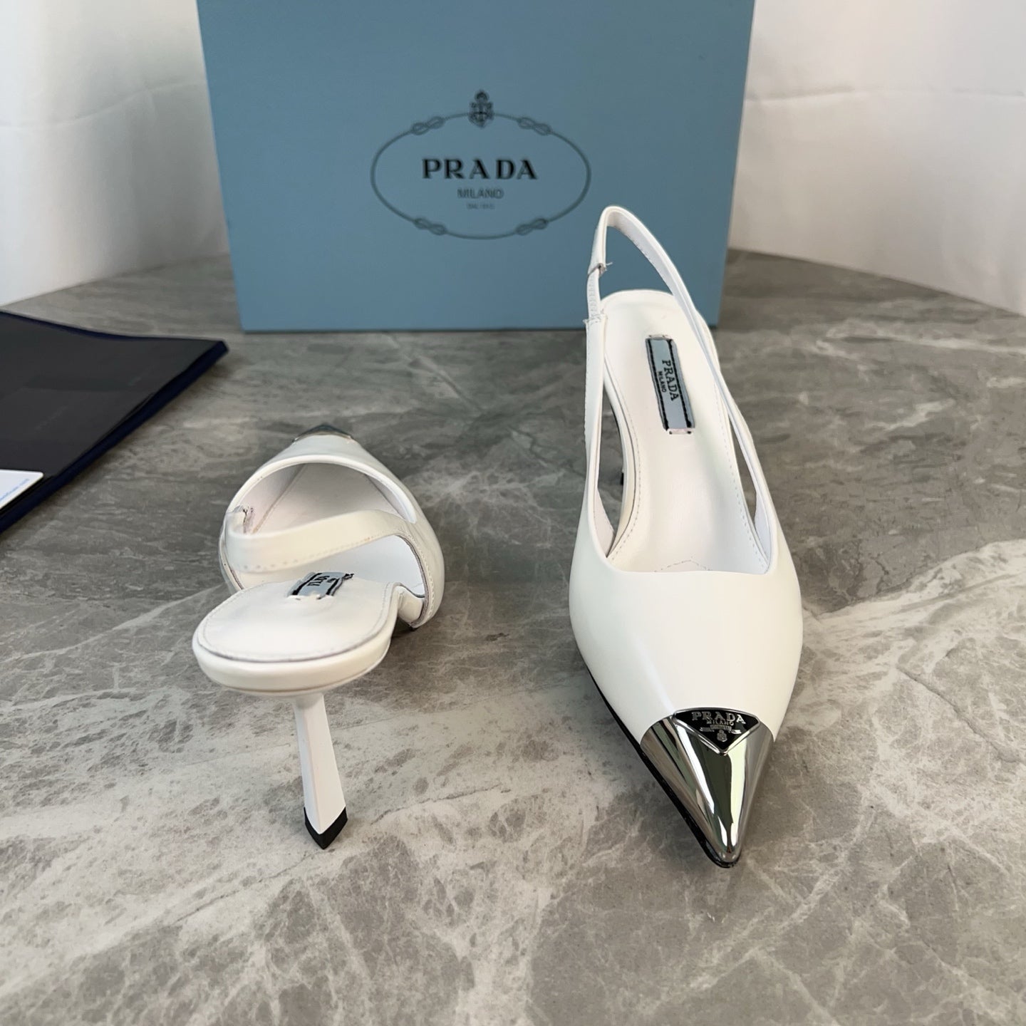PRADA 25S METAL-TOE SLINGBACK PUMPS IN WHITE CALFSKIN - 34