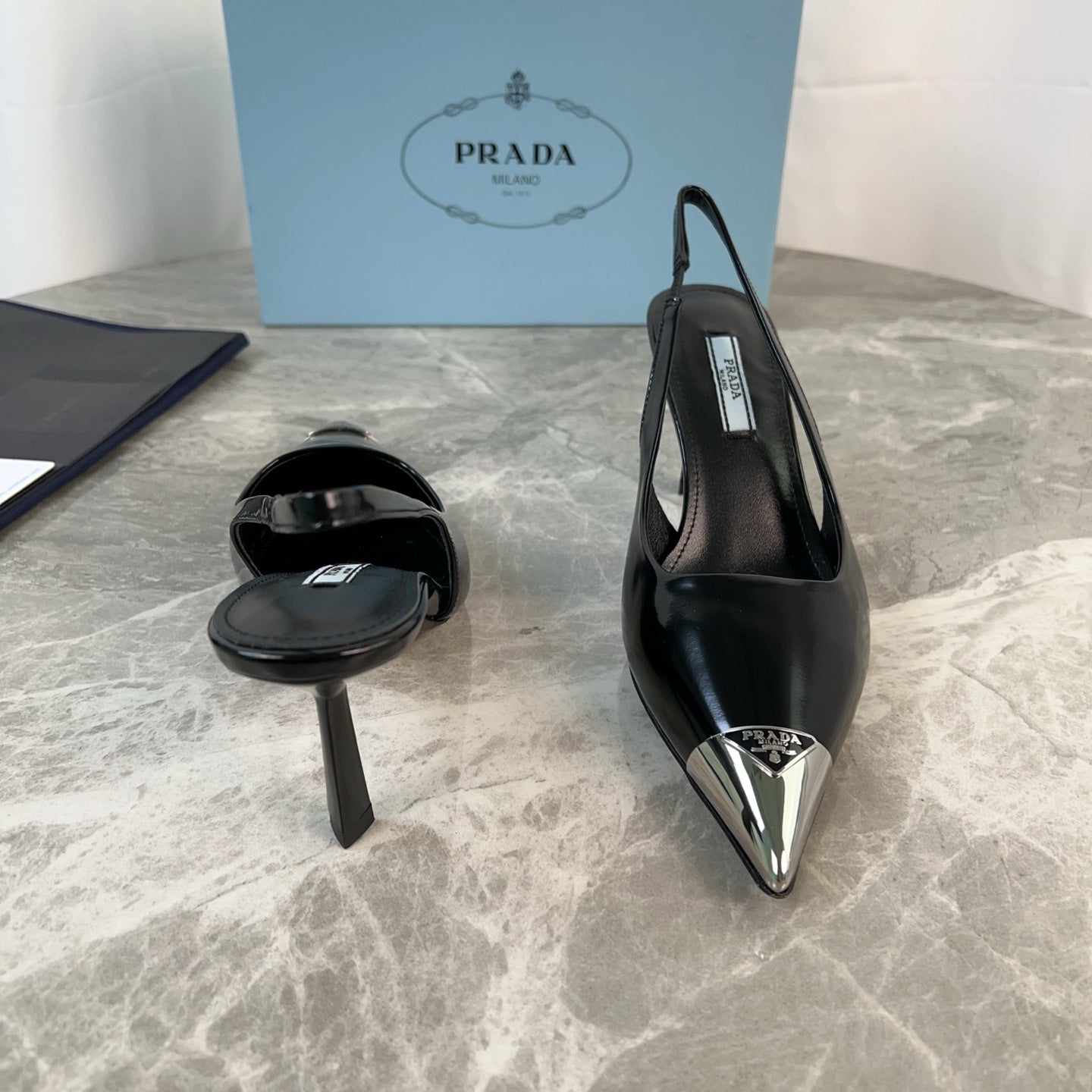 PRADA 25S METAL-TOE SLINGBACK PUMPS IN BLACK CALFSKIN - 34
