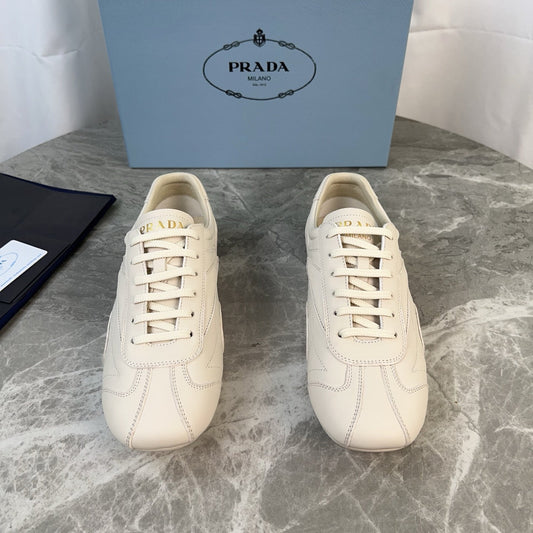 PRADA 25S MONTECARLO ANTIQUED SNEAKERS IN CHALK WHITE NAPPA LEATHER - 35