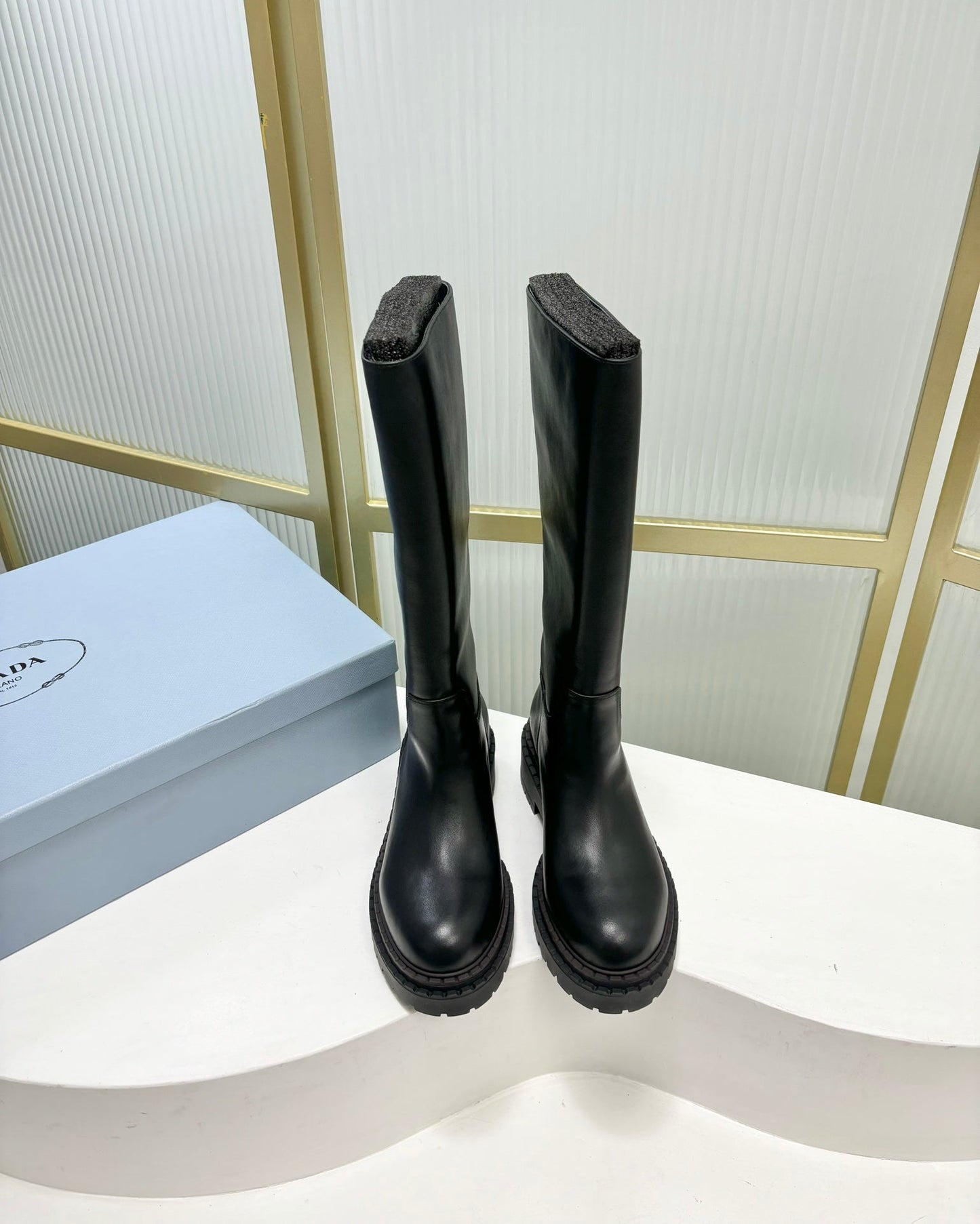 KNEE BOOTS WITH TRIANGLE LOGO IN BLACK CALFSKIN - 35