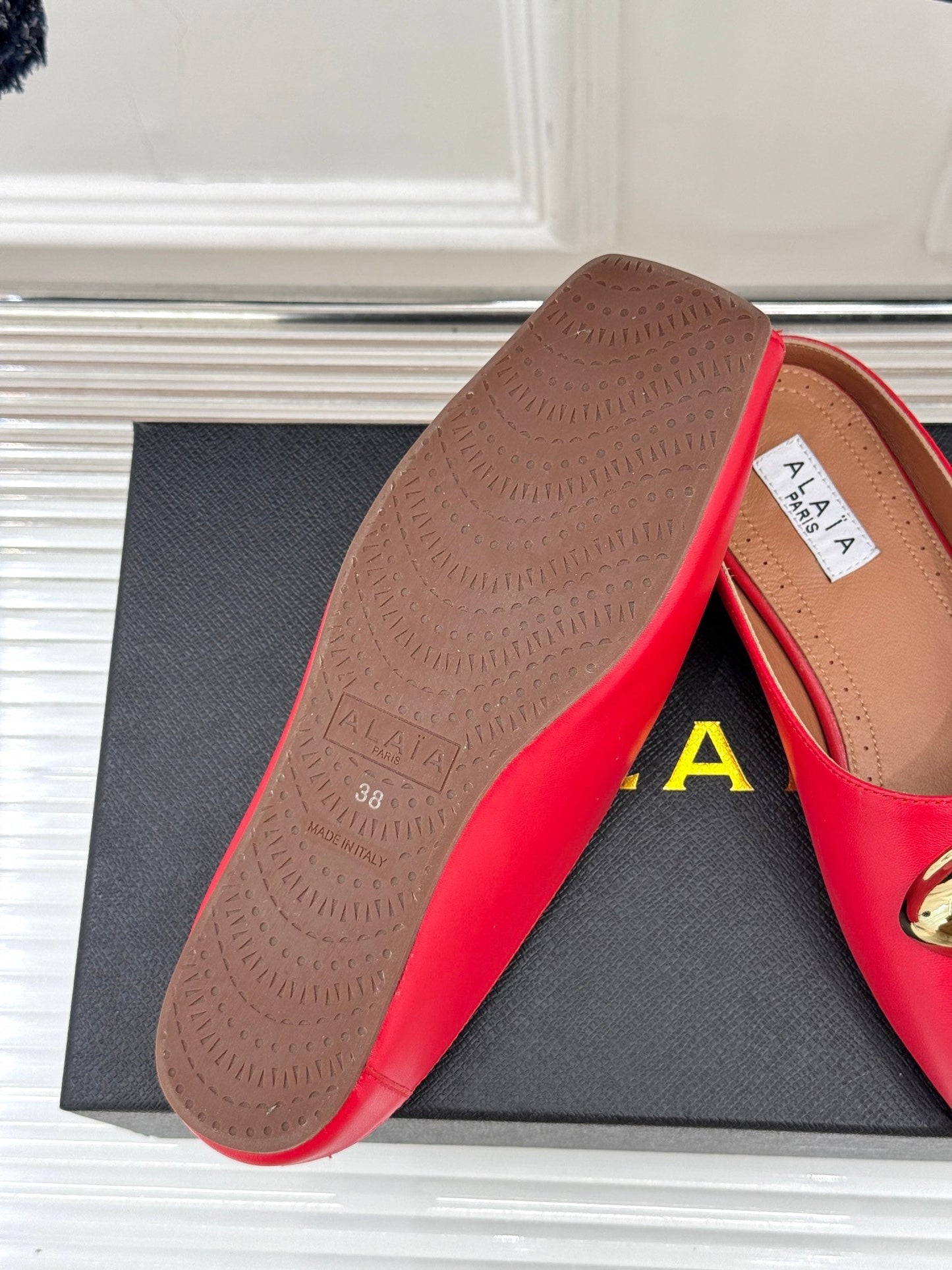 ALAIA FLAT MULE IN CRIMSON RED LAMBSKIN WITH GOLD HARDWARE - 35