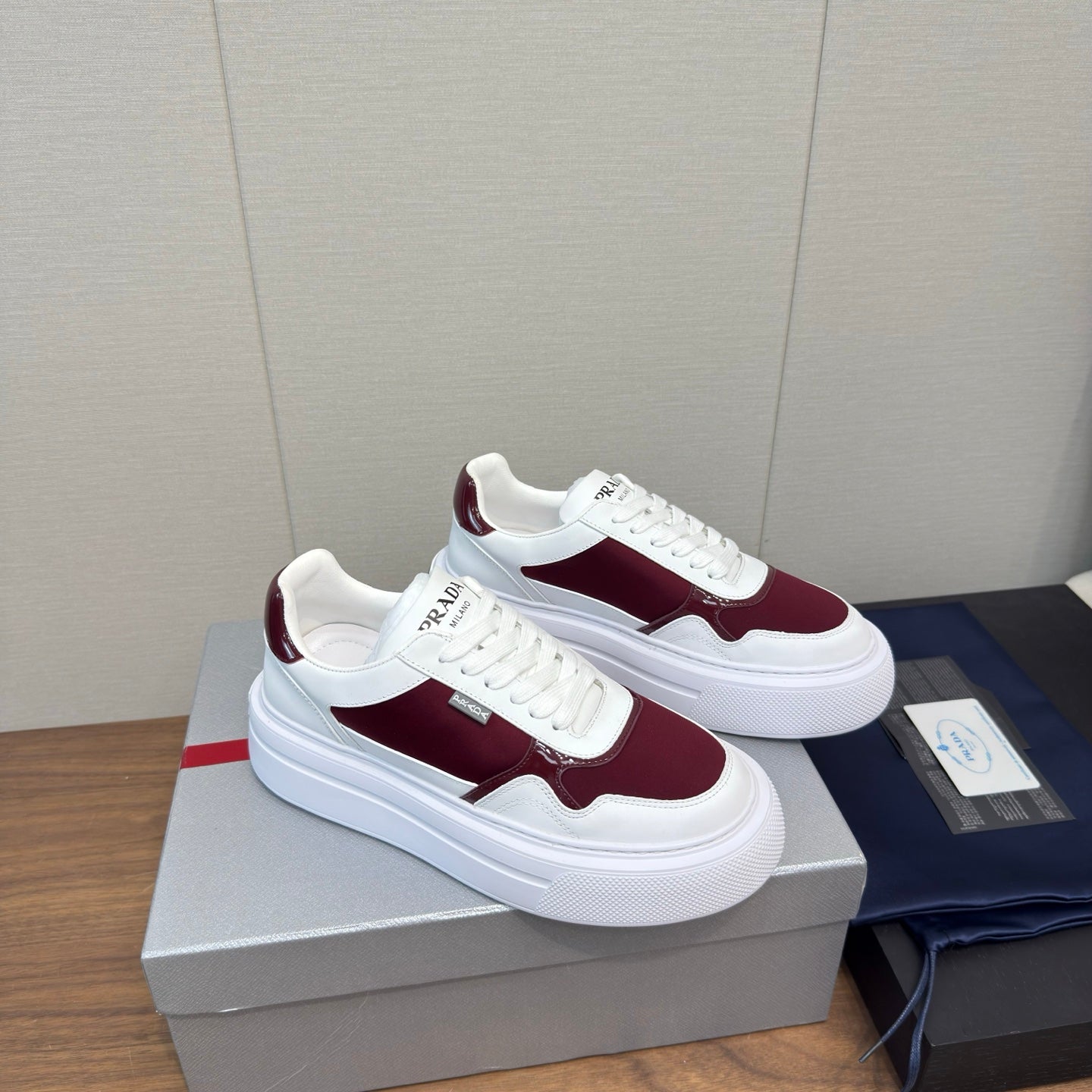 PRADA 25S DOWNTOWN BOLD SNEAKERS 45MM IN WHITE AND BURGUNDY CALFSKIN - 35