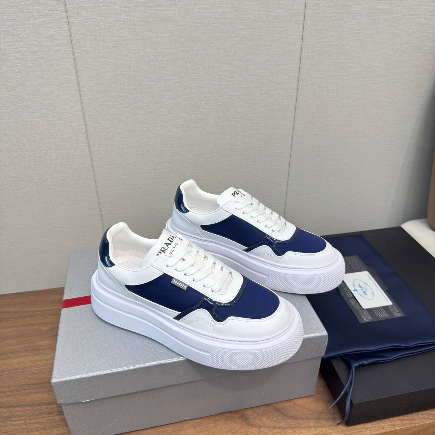 PRADA 25S DOWNTOWN BOLD SNEAKERS 45MM IN WHITE AND NAVY BLUE CALFSKIN - 35