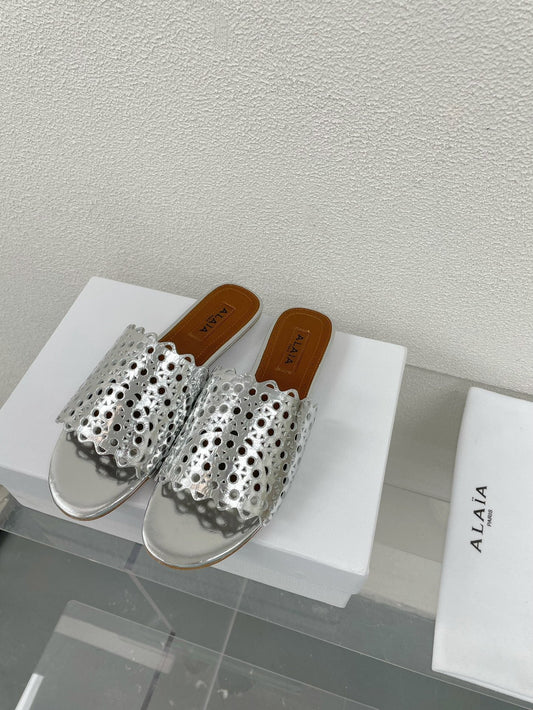 ALAIA VIENNE FLAT MULES IN SILVER LAMBSKIN - 34