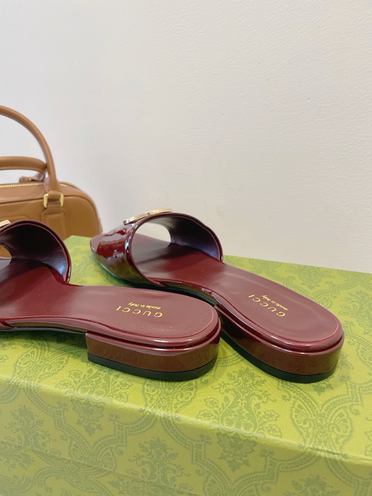 SLIDE SANDALS IN WINE RED GLOSSY SHEEPSKIN ENAMELLED ROUND INTERLOCKING G - 35