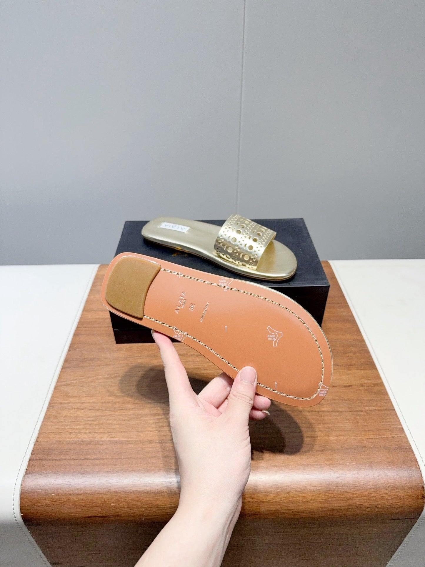 ALAIA FLAT SANDALS WITH PERFORATED STRAPS 25S IN GOLD LAMBSKIN - 35