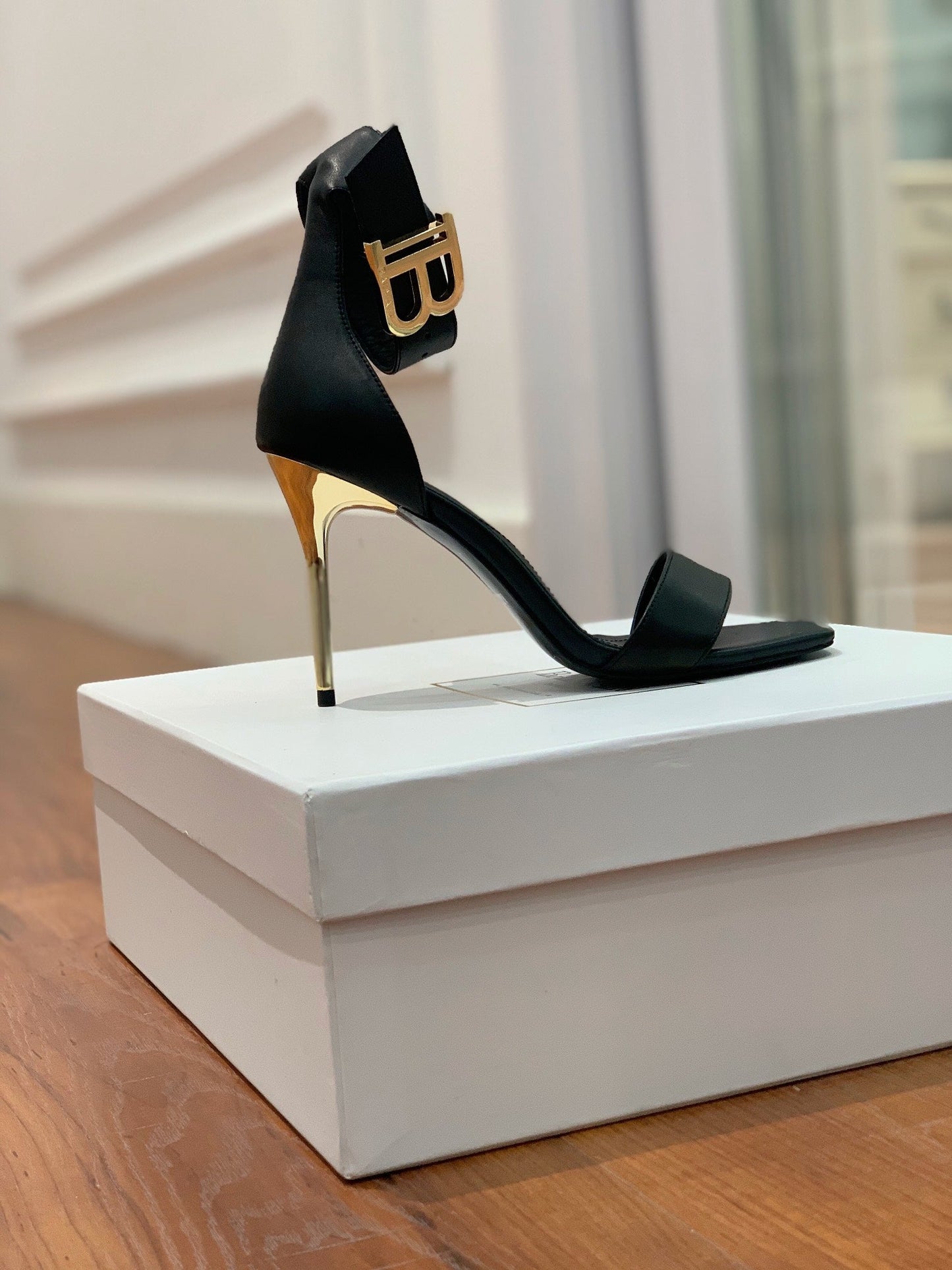 BALMAIN 25S THIN STRAP HIGH HEELS 105MM IN BLACK CALFSKIN GOLD HARDWARE - 35