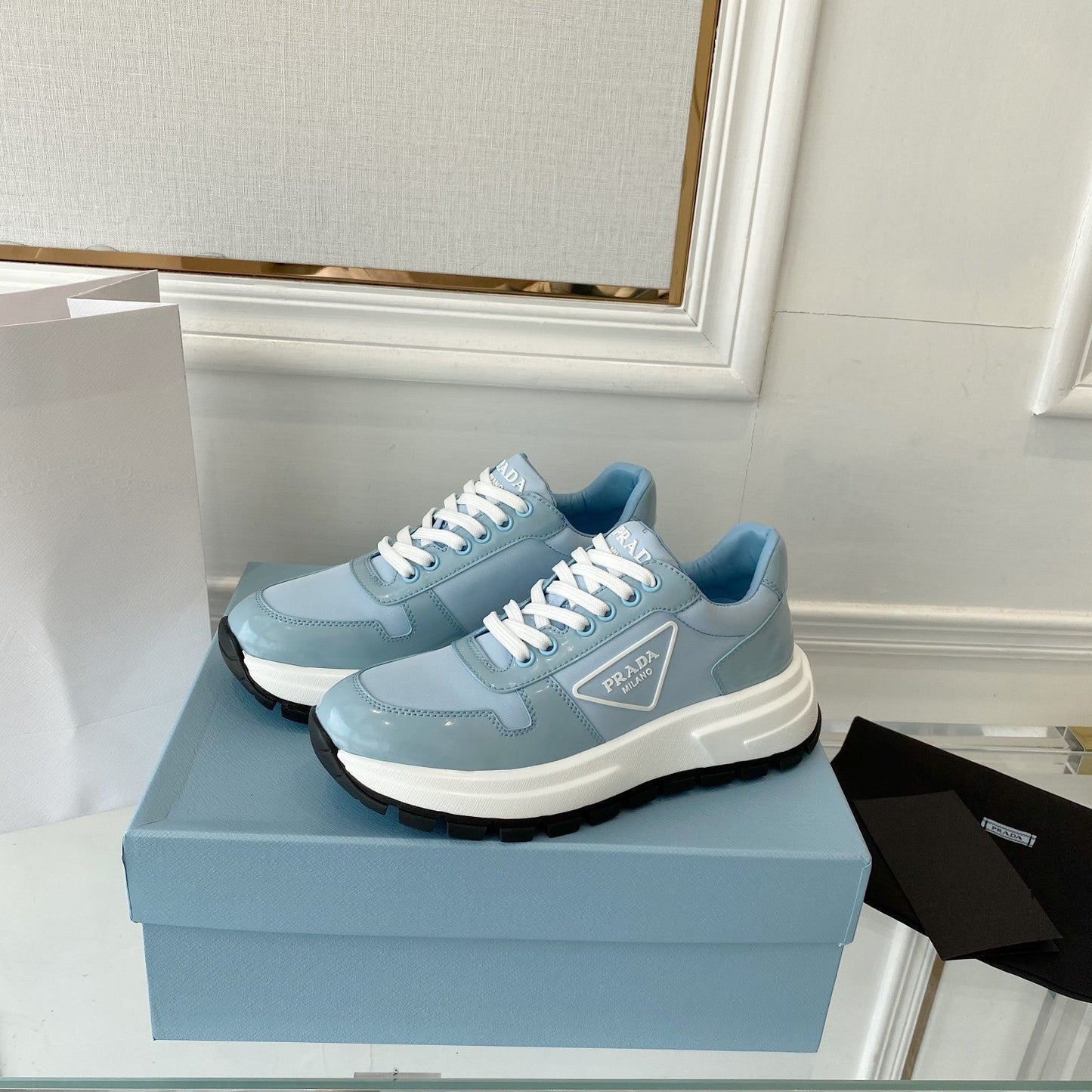 PRADA 25S THICK SOLE SNEAKER IN LIGHT BLUE CALFSKIN AND CANVAS - 34