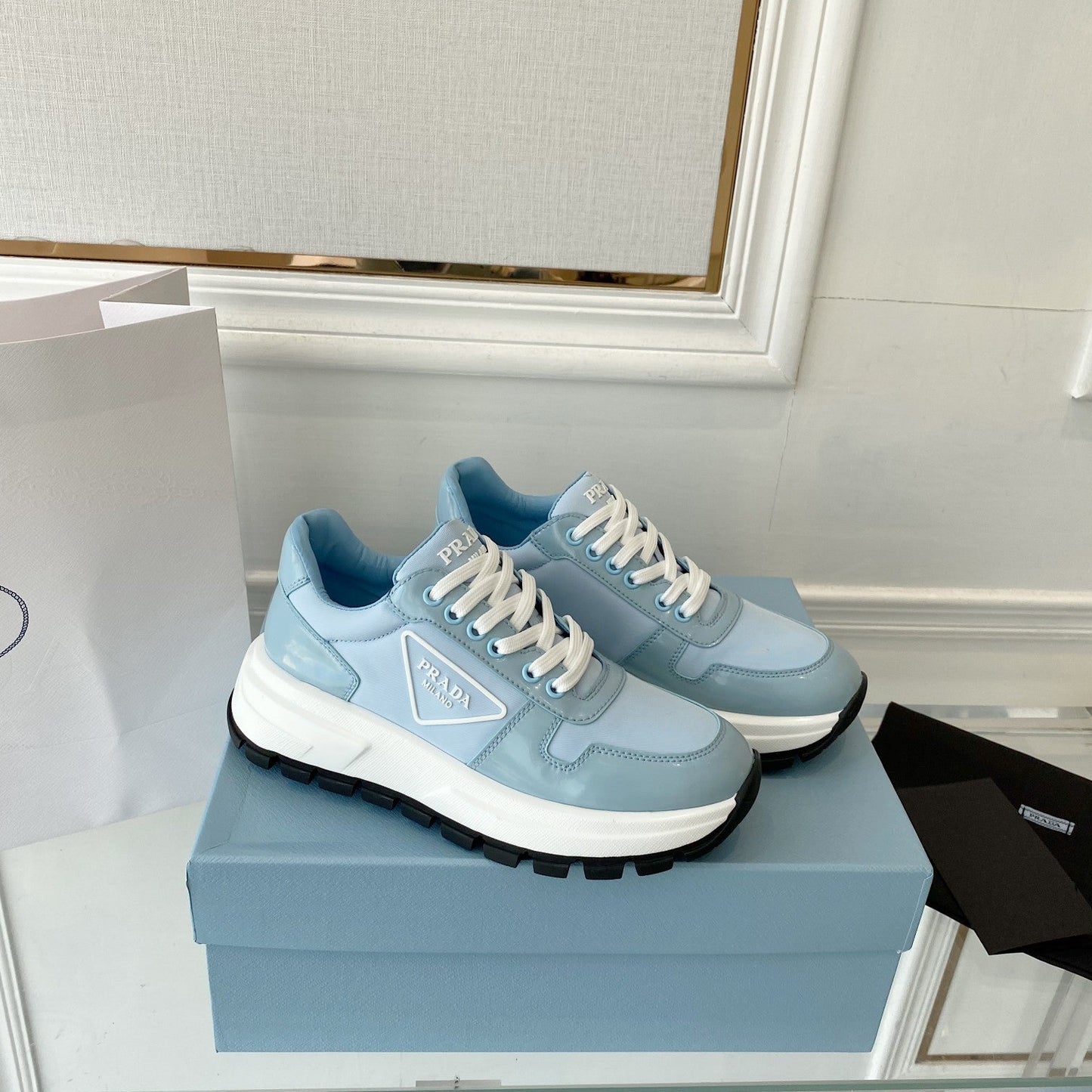 PRADA 25S THICK SOLE SNEAKER IN LIGHT BLUE CALFSKIN AND CANVAS - 34