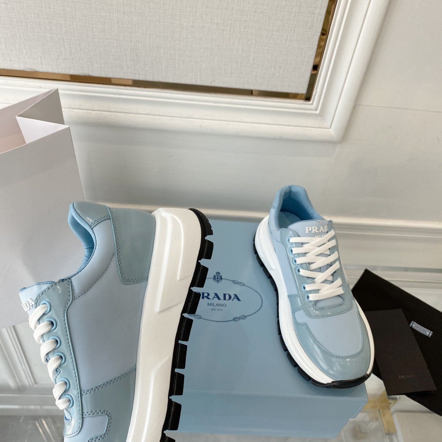 PRADA 25S THICK SOLE SNEAKER IN LIGHT BLUE CALFSKIN AND CANVAS - 34
