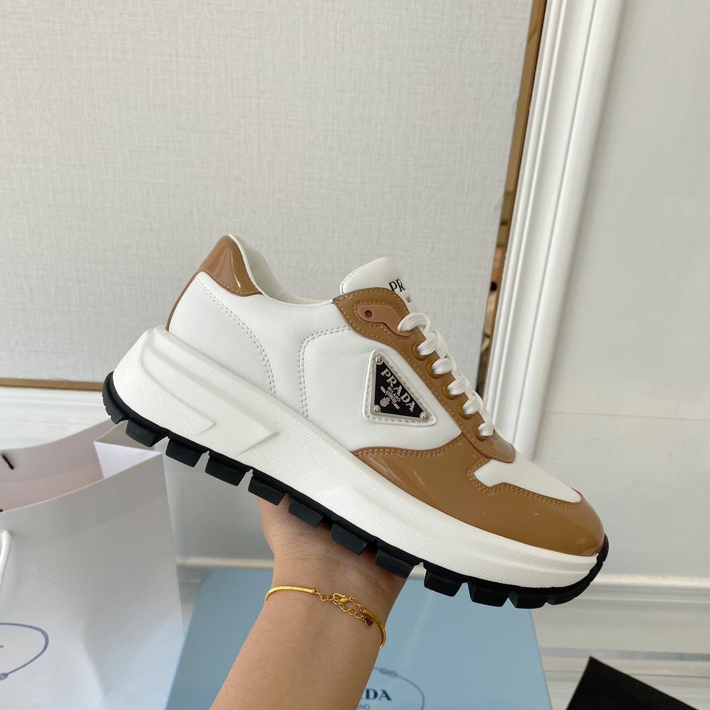 PRADA 25S THICK SOLE SNEAKER IN WHITE AND BROWN CALFSKIN - 34