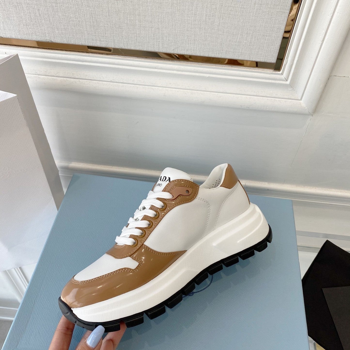 PRADA 25S THICK SOLE SNEAKER IN WHITE AND BROWN CALFSKIN - 34