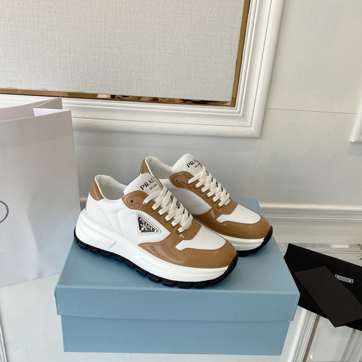 PRADA 25S THICK SOLE SNEAKER IN WHITE AND BROWN CALFSKIN - 34