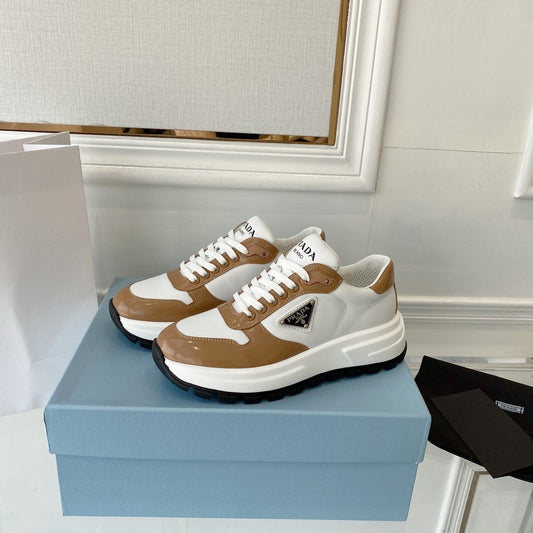 PRADA 25S THICK SOLE SNEAKER IN WHITE AND BROWN CALFSKIN - 34