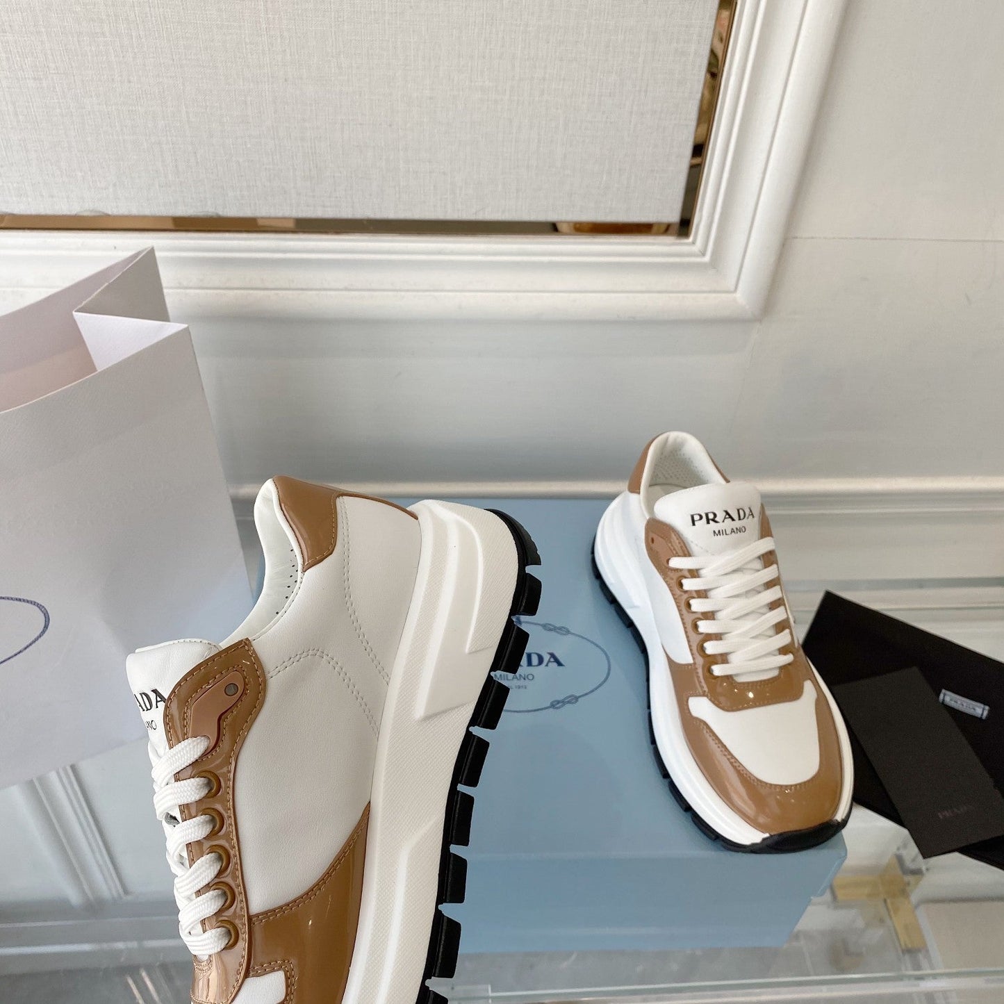 PRADA 25S THICK SOLE SNEAKER IN WHITE AND BROWN CALFSKIN - 34