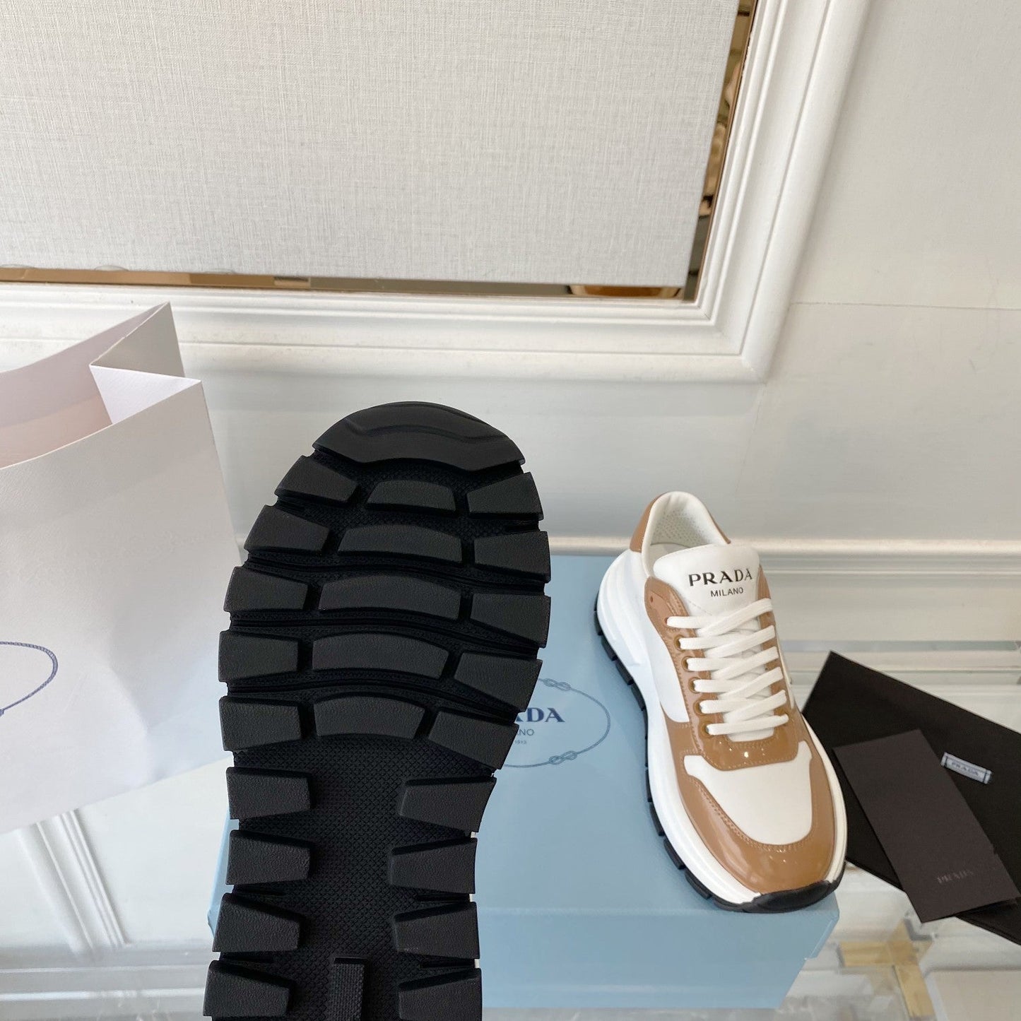 PRADA 25S THICK SOLE SNEAKER IN WHITE AND BROWN CALFSKIN - 34