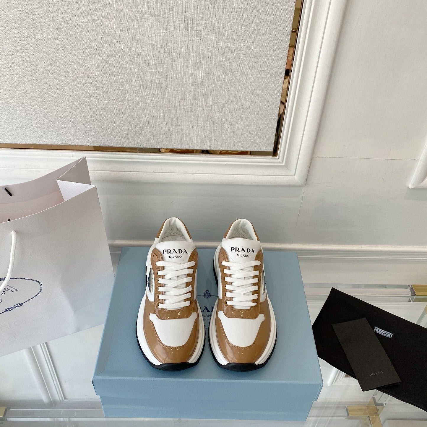 PRADA 25S THICK SOLE SNEAKER IN WHITE AND BROWN CALFSKIN - 34