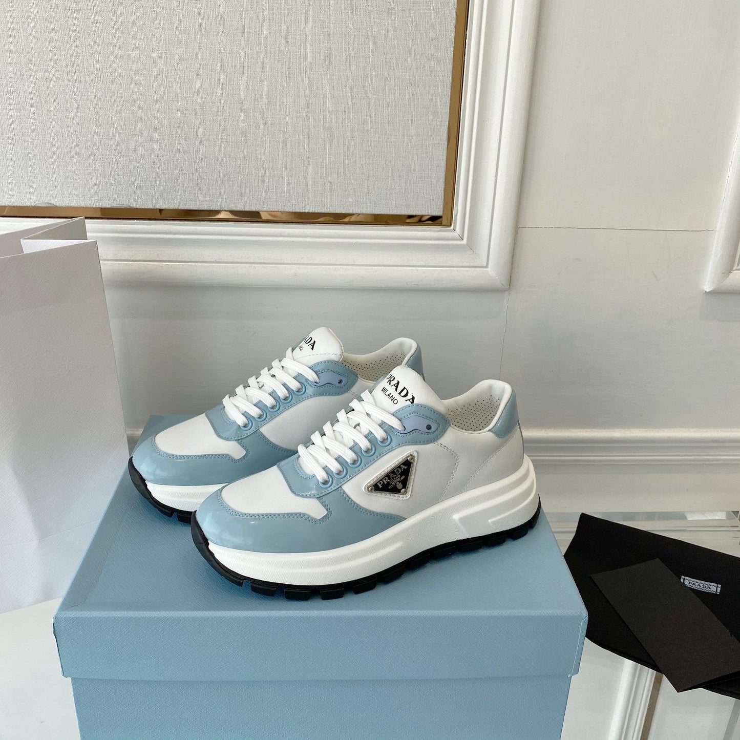 PRADA 25S THICK SOLE SNEAKER IN WHITE AND LIGHT BLUE CALFSKIN - 34