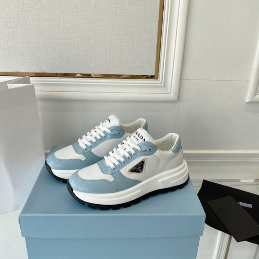 PRADA 25S THICK SOLE SNEAKER IN WHITE AND LIGHT BLUE CALFSKIN - 34