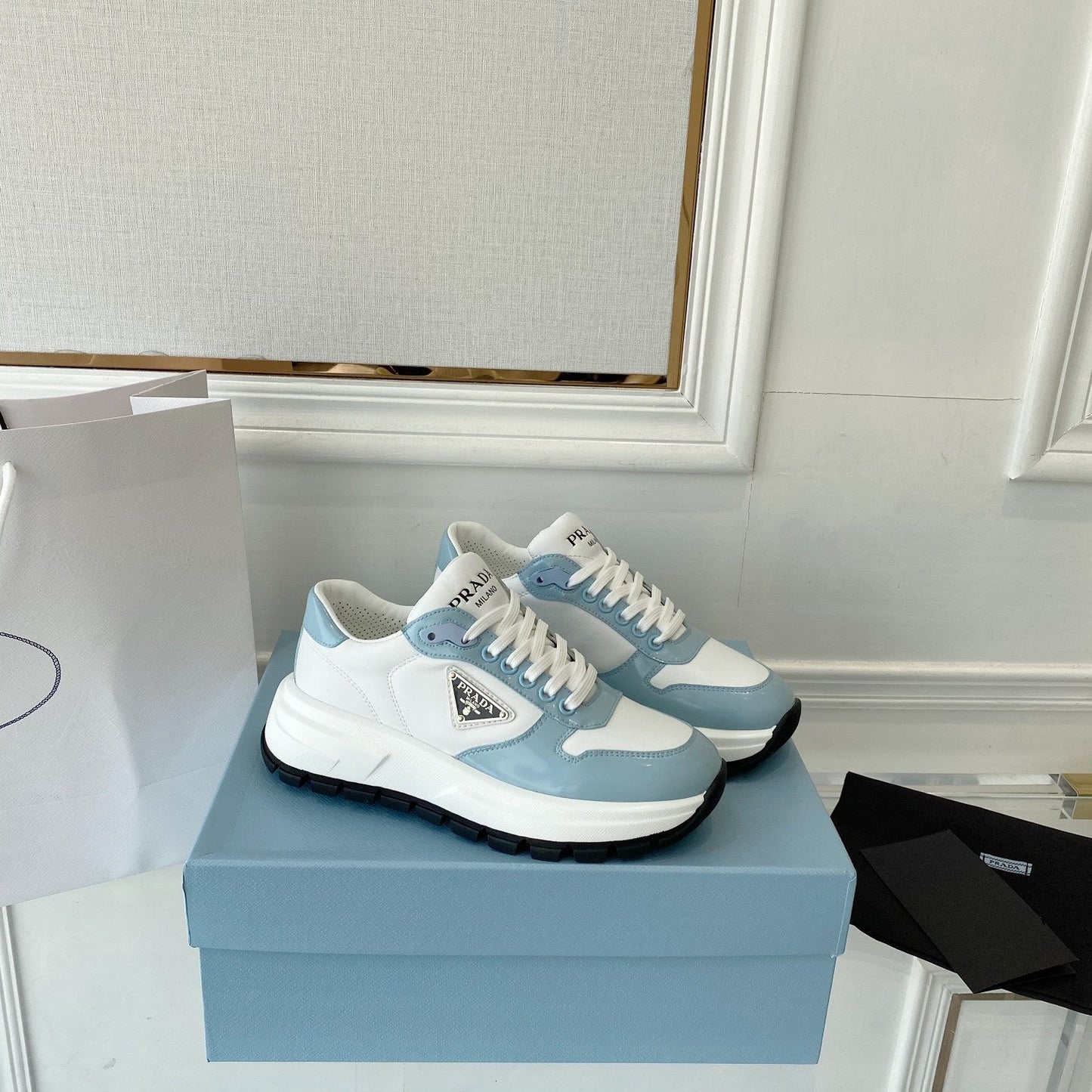 PRADA 25S THICK SOLE SNEAKER IN WHITE AND LIGHT BLUE CALFSKIN - 34