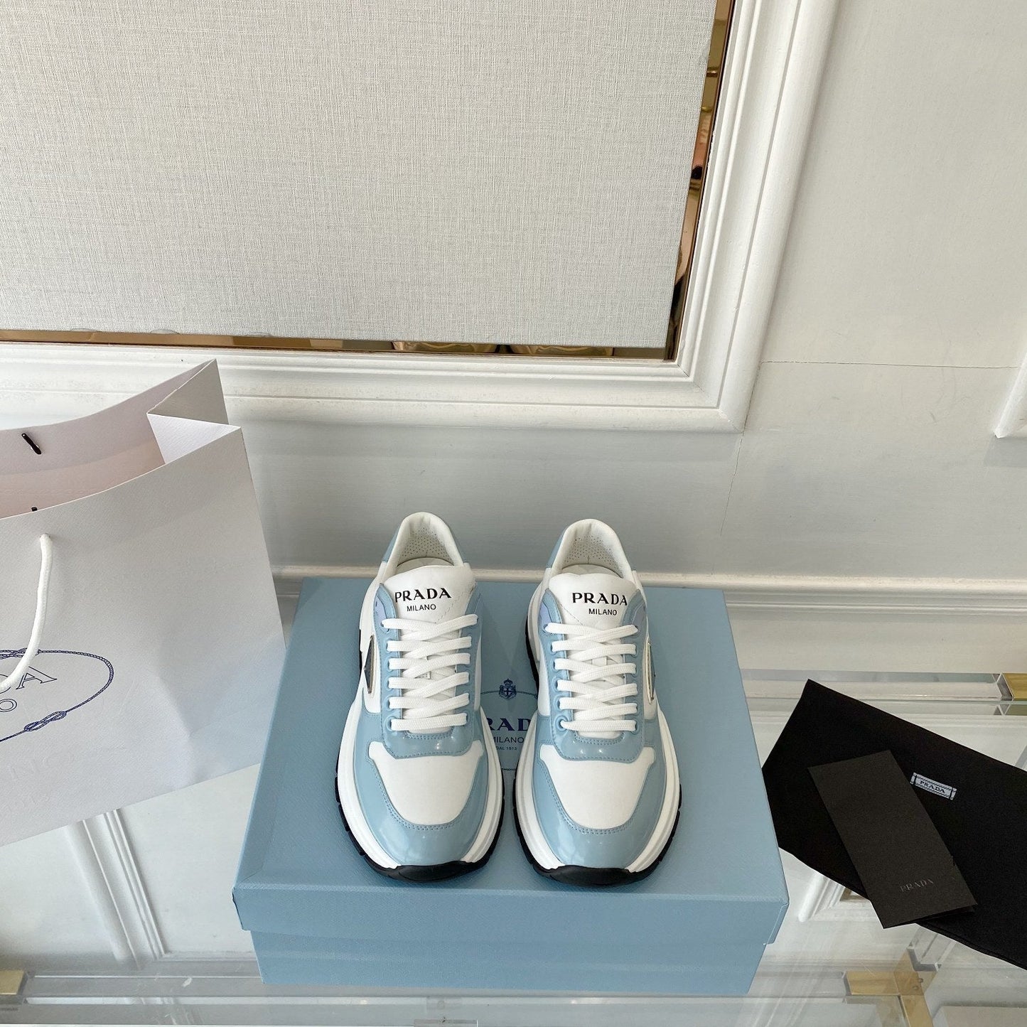 PRADA 25S THICK SOLE SNEAKER IN WHITE AND LIGHT BLUE CALFSKIN - 34