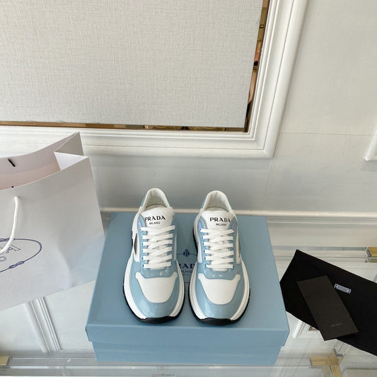 PRADA 25S THICK SOLE SNEAKER IN WHITE AND LIGHT BLUE CALFSKIN - 34