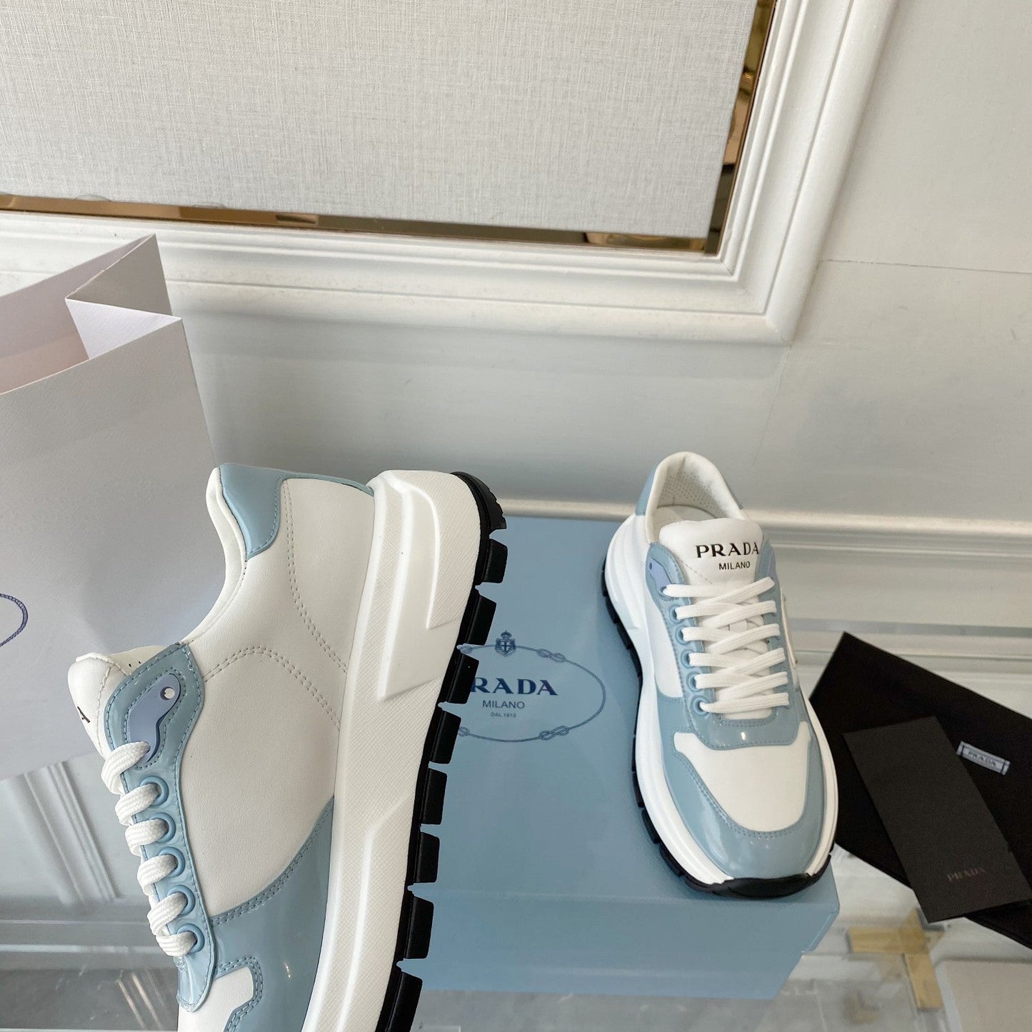 PRADA 25S THICK SOLE SNEAKER IN WHITE AND LIGHT BLUE CALFSKIN - 34
