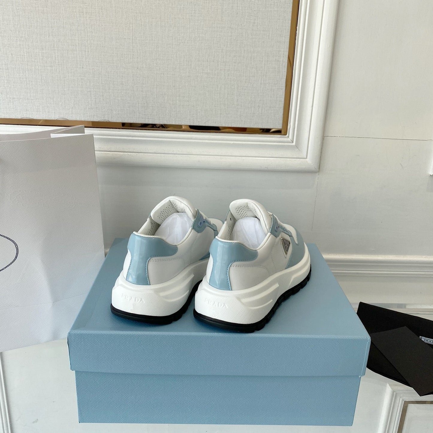 PRADA 25S THICK SOLE SNEAKER IN WHITE AND LIGHT BLUE CALFSKIN - 34
