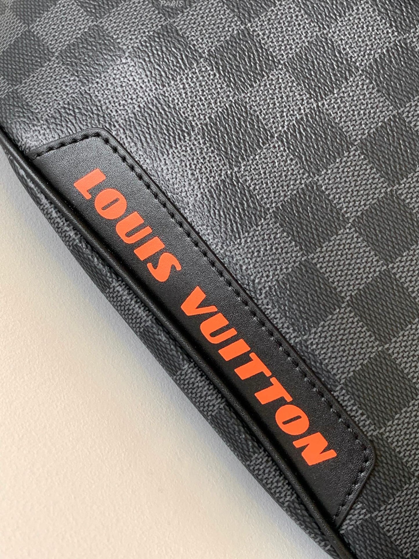 LV 25S BUMBAG 37 IN BLACK AND ORANGE COATED MONOGRAM CALFSKIN