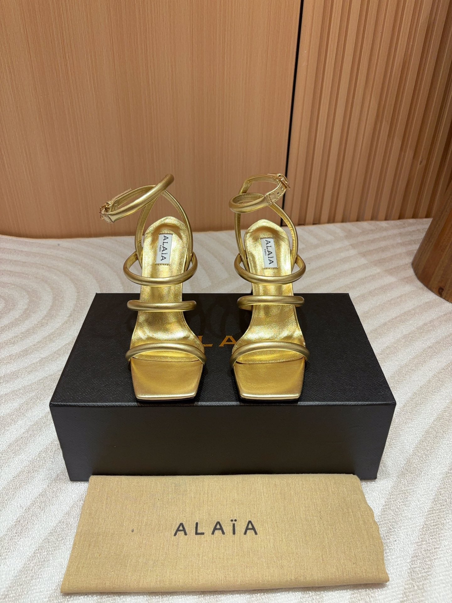 ALAIA THREE-STRAPS HIGH HEEL SANDALS IN GOLDEN PATENT LAMBSKIN - 35