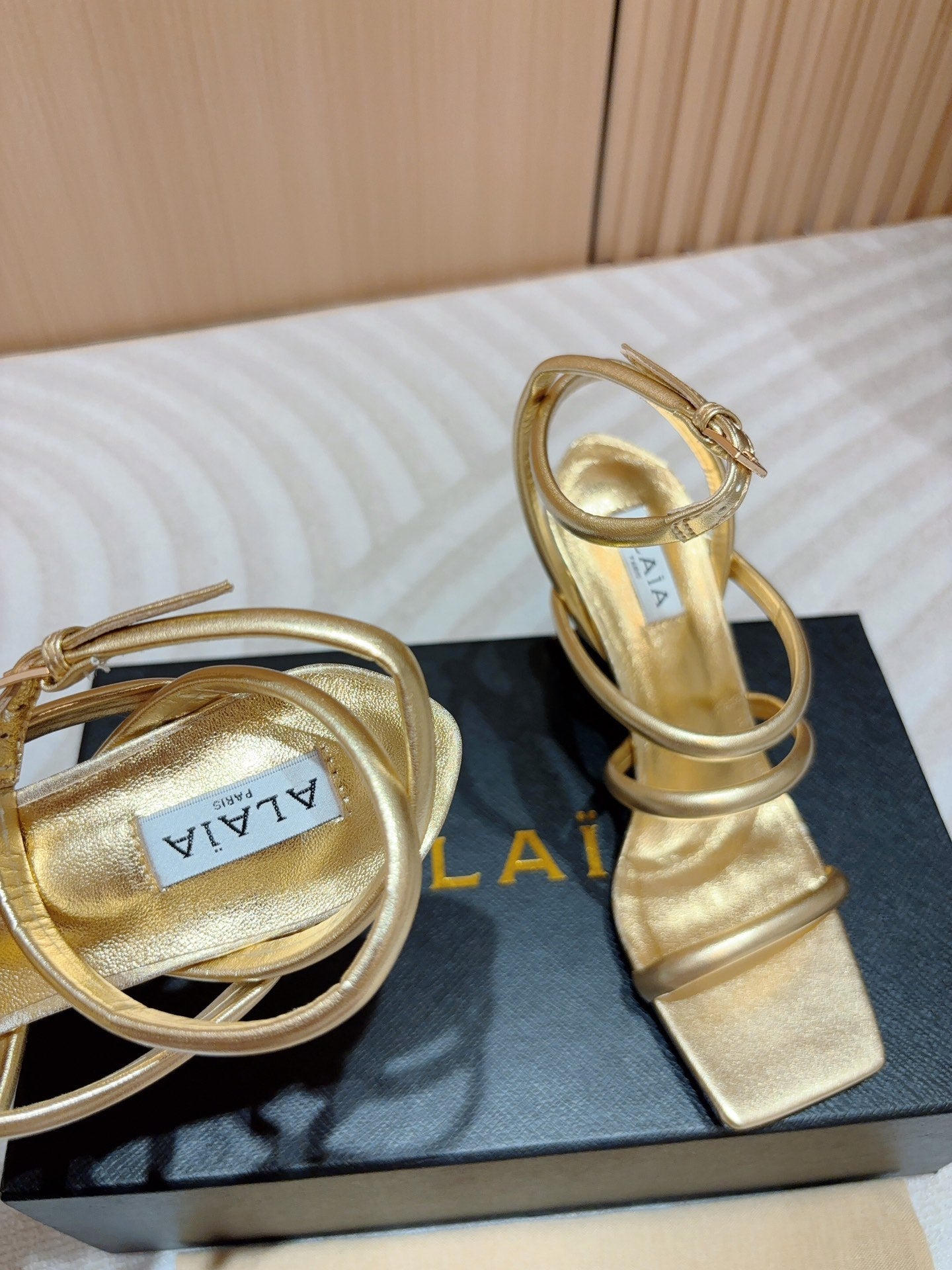 ALAIA THREE-STRAPS HIGH HEEL SANDALS IN GOLDEN PATENT LAMBSKIN - 35