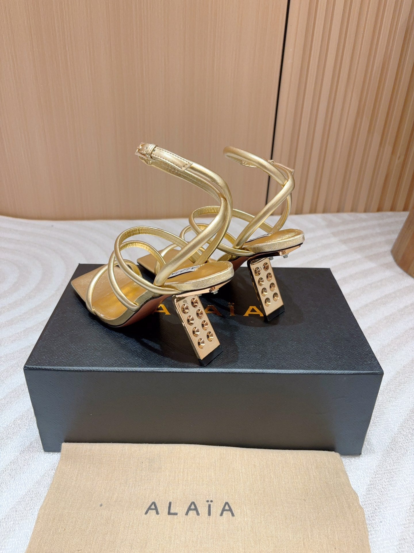 ALAIA THREE-STRAPS HIGH HEEL SANDALS IN GOLDEN PATENT LAMBSKIN - 35