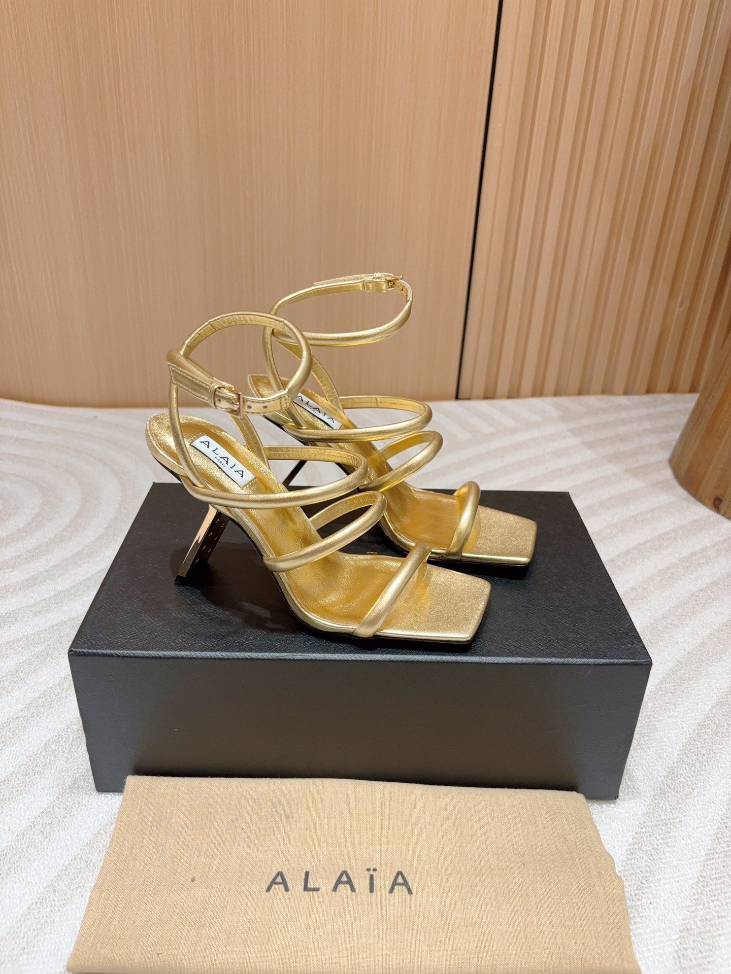 ALAIA THREE-STRAPS HIGH HEEL SANDALS IN GOLDEN PATENT LAMBSKIN - 35