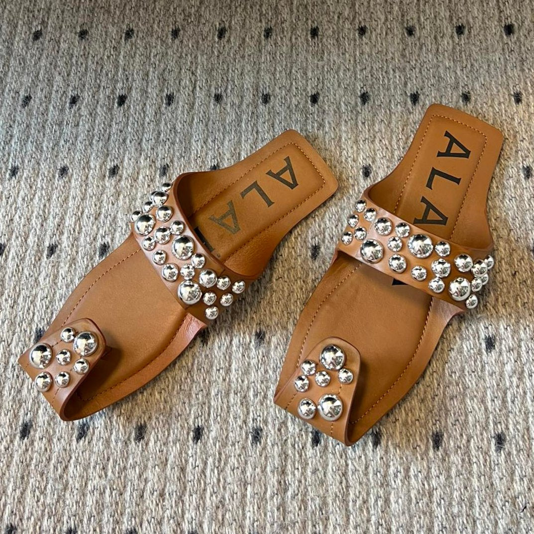 ALAIA FOLDED FLAT MULES WITH SPHERES ON COPPER BROWN CALFSKIN - 35