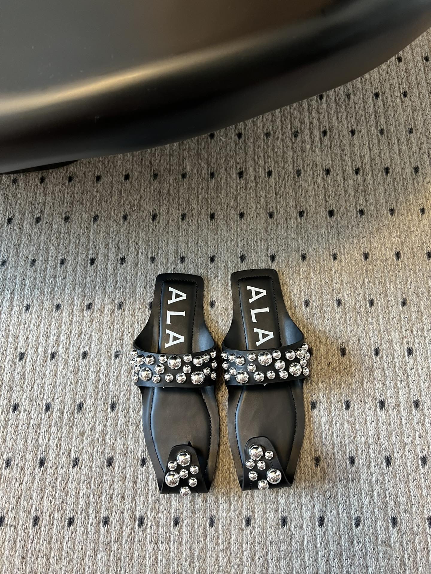 ALAIA FOLDED FLAT MULES WITH SPHERES ON BLACK CALFSKIN - 35