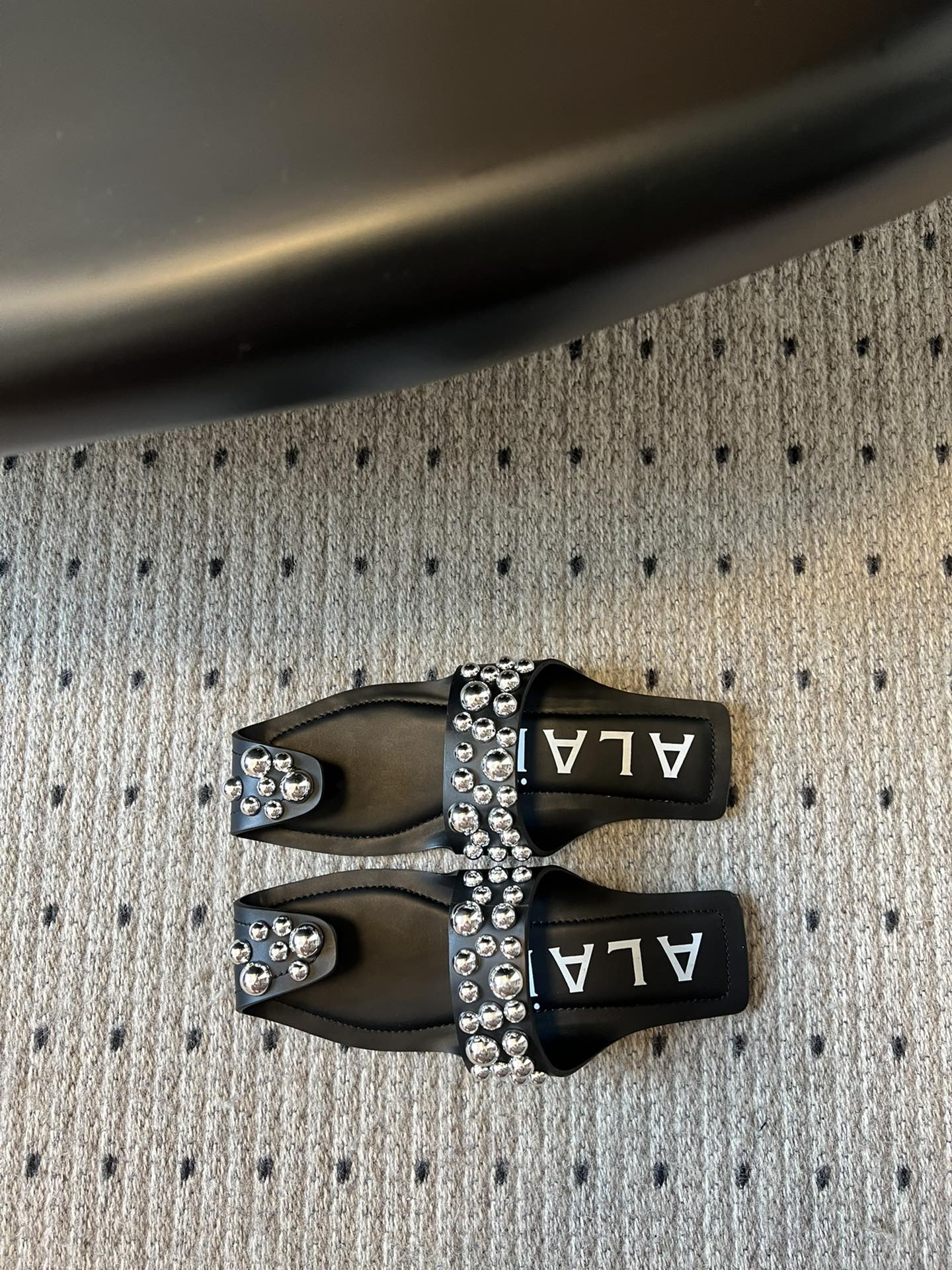 ALAIA FOLDED FLAT MULES WITH SPHERES ON BLACK CALFSKIN - 35
