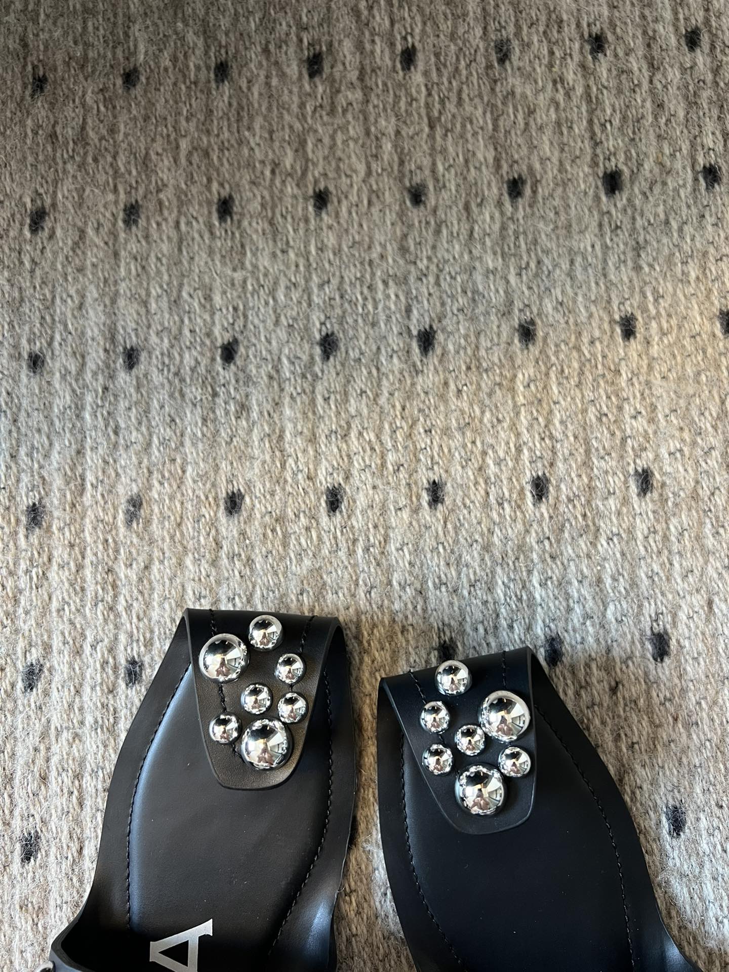ALAIA FOLDED FLAT MULES WITH SPHERES ON BLACK CALFSKIN - 35