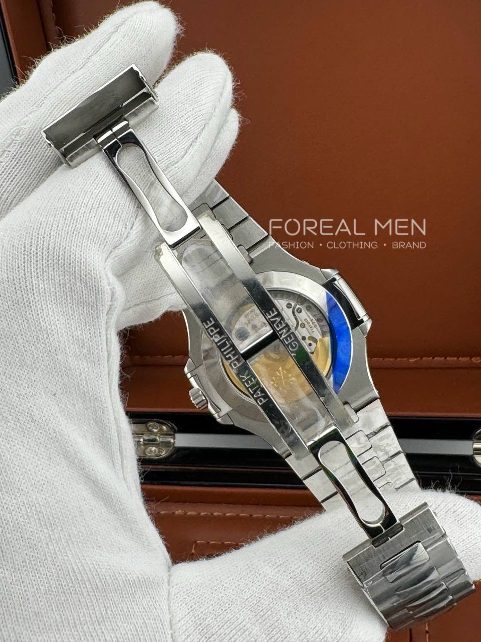 Patek Philippe Nautilus Stainless Steel Watch with White Dial & Annual Calendar