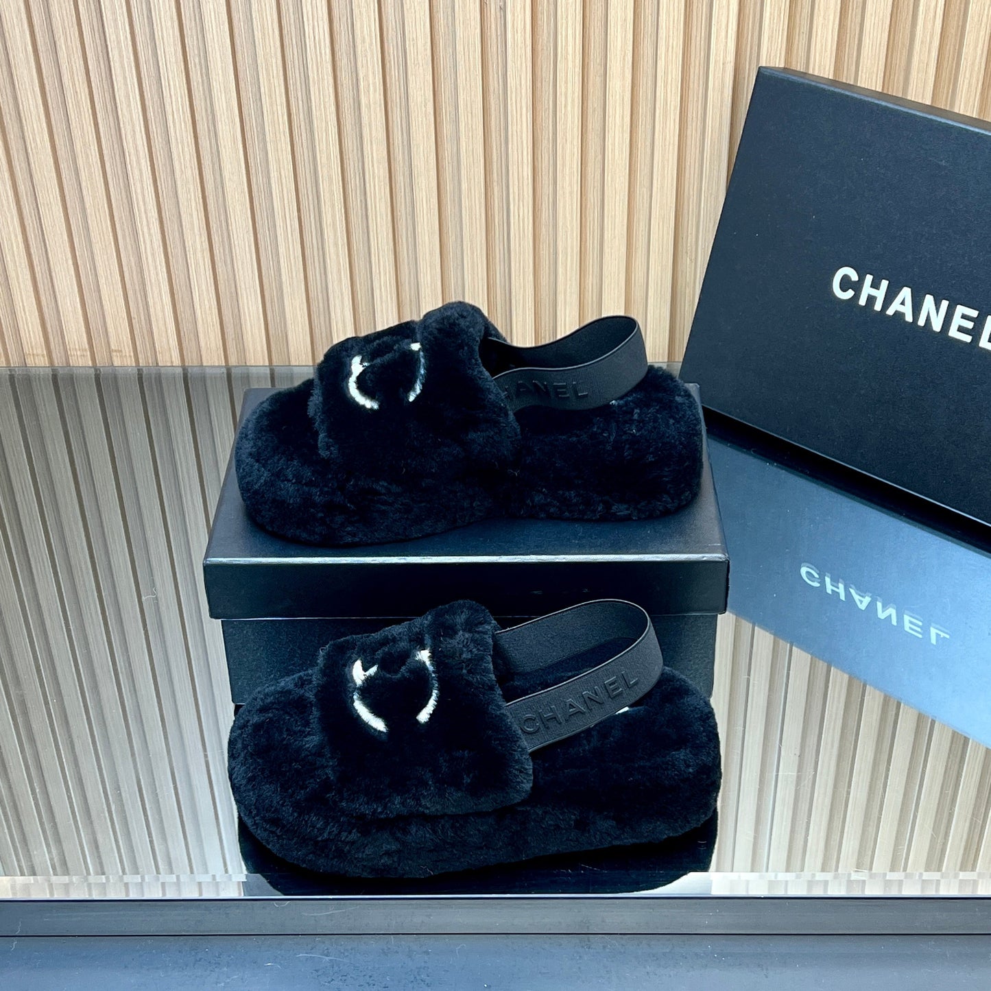 CHANEL 25S THICK-SOLED FURRY SLIPPERS WITH ELASTIC STRAPS IN BLACK FUR - 35