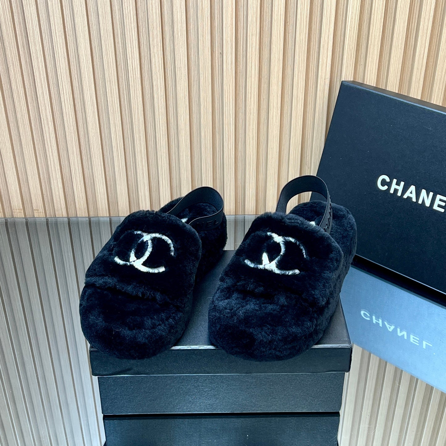 CHANEL 25S THICK-SOLED FURRY SLIPPERS WITH ELASTIC STRAPS IN BLACK FUR - 35