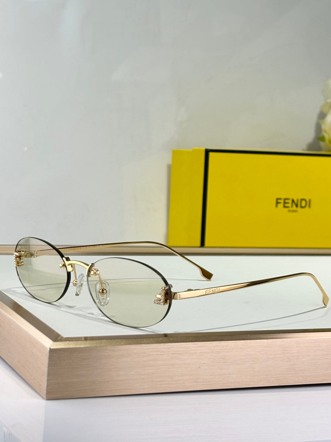 FIRST CRYSTAL RIMLESS OVAL FRAME SUNGLASSES FE4075US IN METAL - Brown