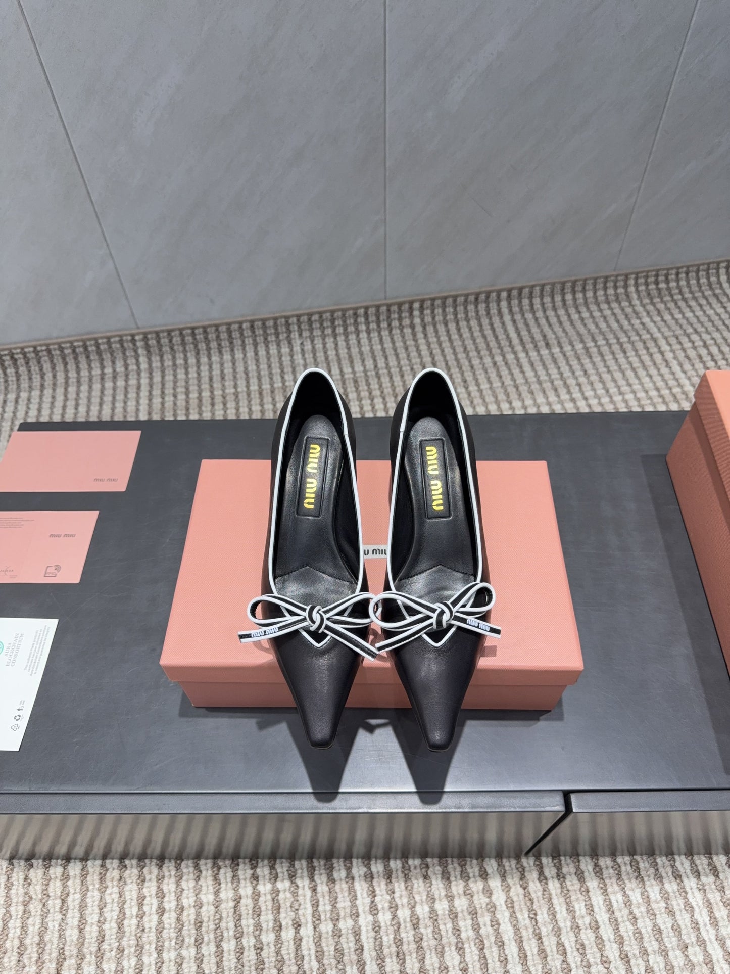 MIUMIU 26S POINTED TOE PUMPS 55MM IN BLACK AND WHITE CALFSKIN WITH BOW