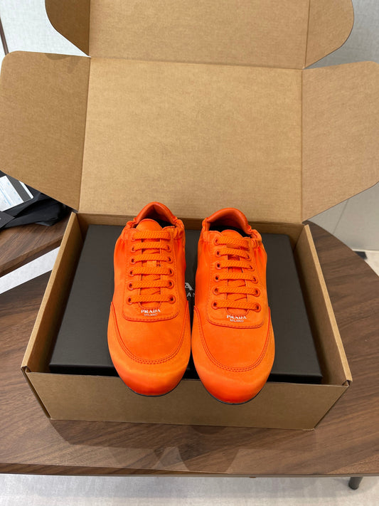 PRADA 25S SNEAKER IN ORANGE SILK - 35