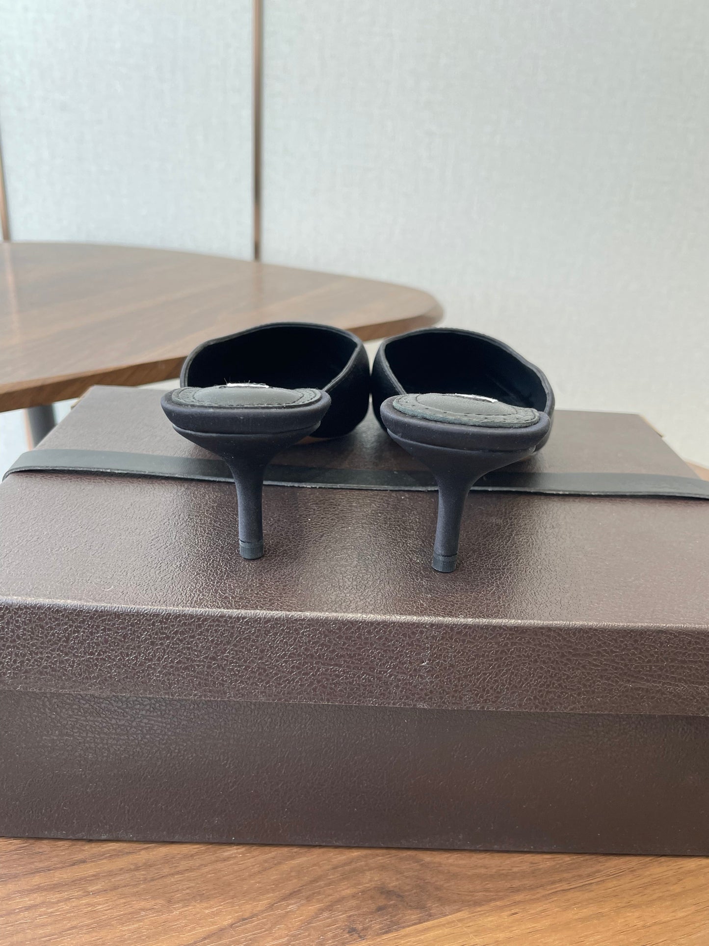 ALAIA 26S HEELED MULES 50 MM IN BLACK FABRIC