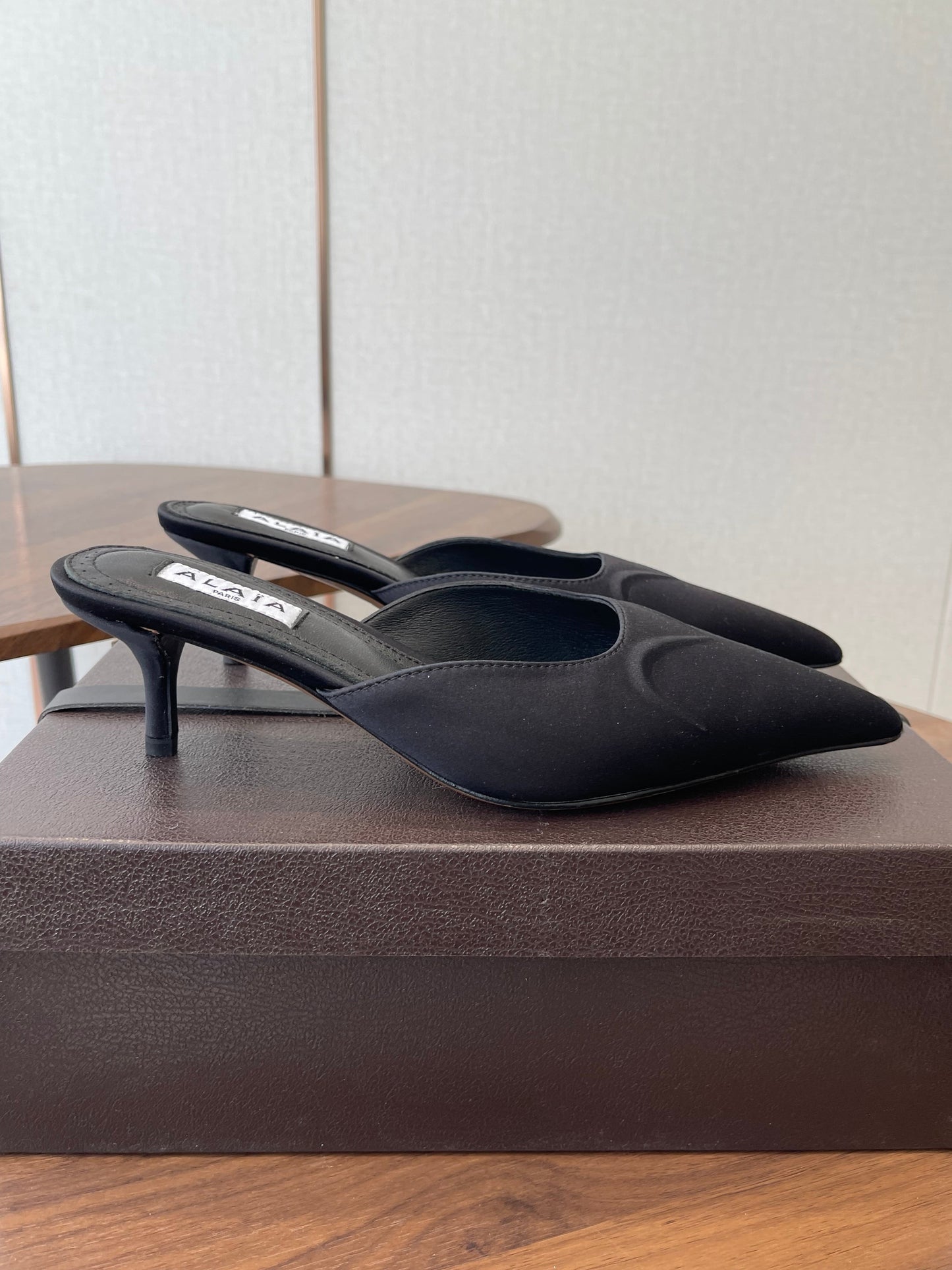 ALAIA 26S HEELED MULES 50 MM IN BLACK FABRIC